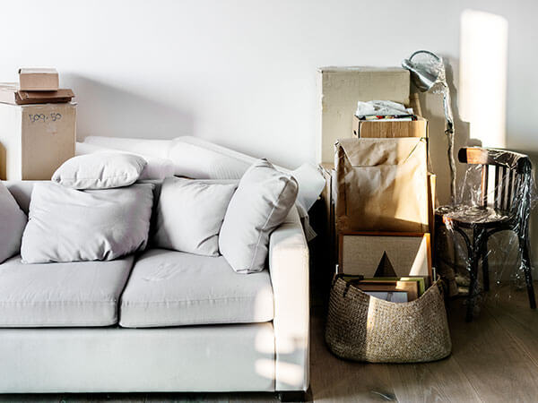 Furniture piled up ready for being taken to a storage facility